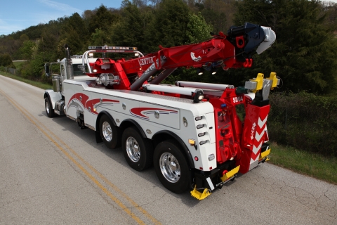 white and red century 1135 rotator on a peterbilt 389 chassis
