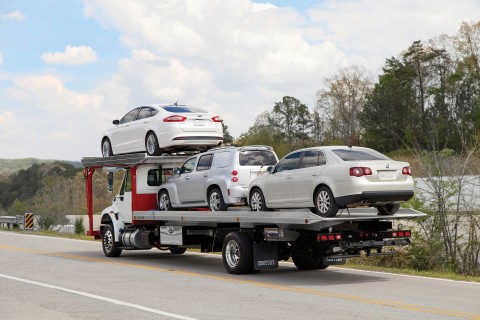 loaded 4 car carrier with three cars