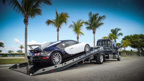 black and white bugatti veyron loaded on a century 12 series lcg carrier with right approach option