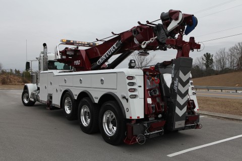 white and red century 1150 rotator on a peterbilt 389 chassis