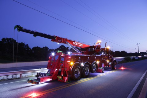 century 1150 rotator at night on the street working a recovery
