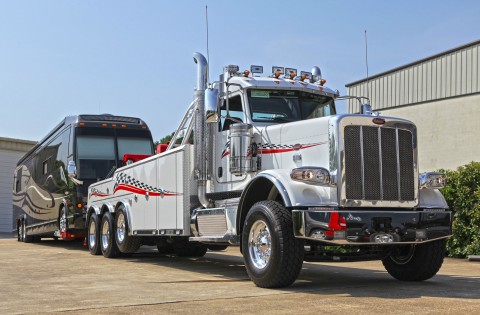 Towing a motorcoach with a white Century 9055 on a Peterbilt 389 chassis