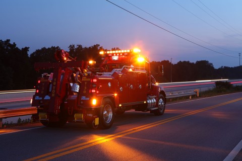 Vulcan V-30 along an roadside in the evening with lights on