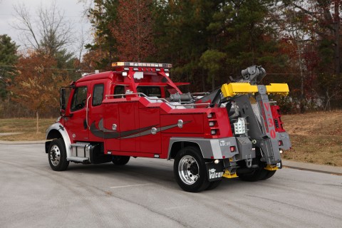 side photo of a red vulcan v-30 in a parking lot