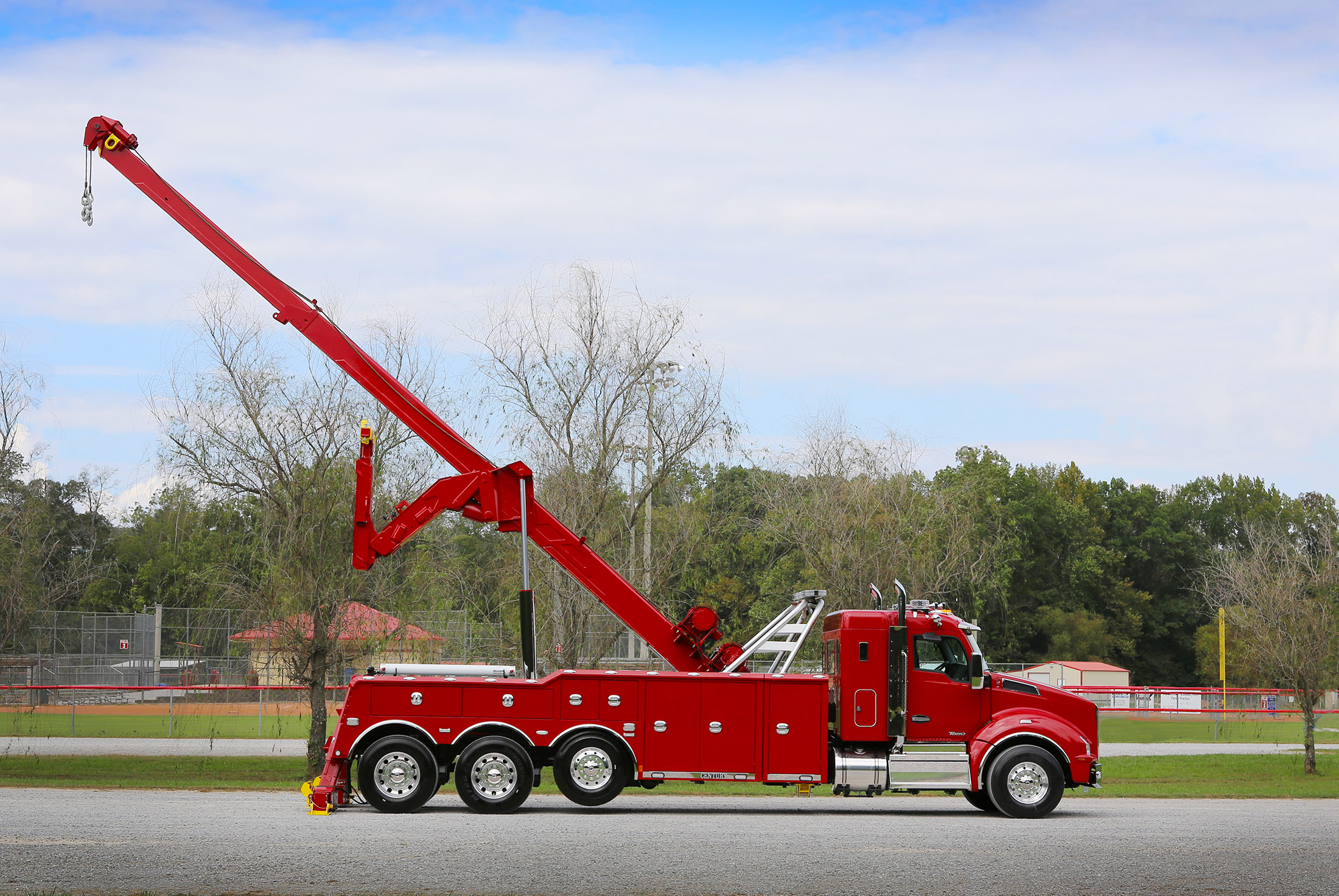 Red Century 9055XL with polybody option on a Kenworth T880 chassis