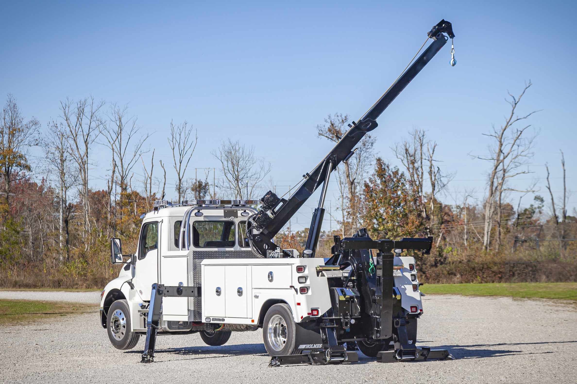 white holmes 600r rotator on a kenworth chassis stretched out