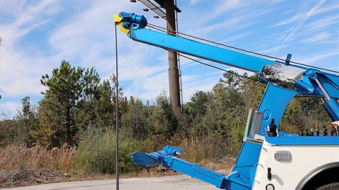 In this picture the recovery boom of a Century 3212 wrecker is fully extended and elevated to show the massive usable boom height when compared to other medium-duty wreckers on the market.