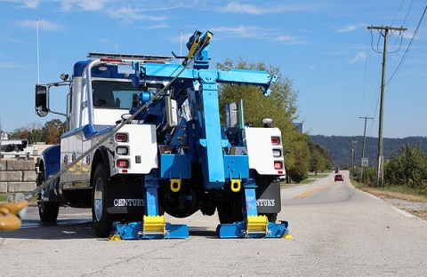 This images show the dual rear hydraulic jack legs found on the medium-duty wreckers from Miller Industries.  These jack legs help provide stability for the wrecker with lifting and winching.