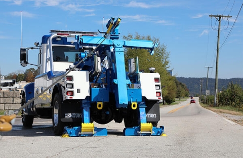 This images show the dual rear hydraulic jack legs found on the medium-duty wreckers from Miller Industries. These jack legs help provide stability for the wrecker with lifting and winching.