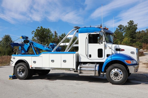 Image shows the front of a Century 3212 medium-duty wrecker to illustrate the weight forward design achieved through specific engineering of the unit and without the need for added counter-weights.
