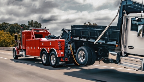 Red Century 5230 on a Peterbilt 589 towing a dump truck