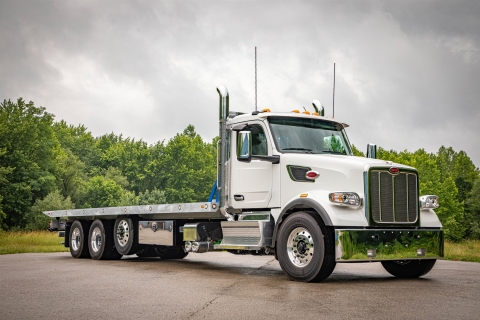 Front view of a Vulcan 40-Series LCG carrier mounted on a Peterbilt 567 truck chassis