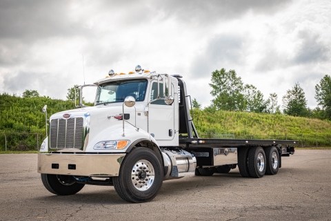 This image shows a Chevron 20-Series LCG carrier mounted on a Peterbilt truck chassis