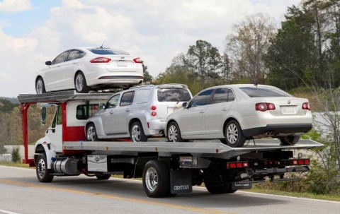 Image showing a loaded 4-car carrier from Miller Industries.