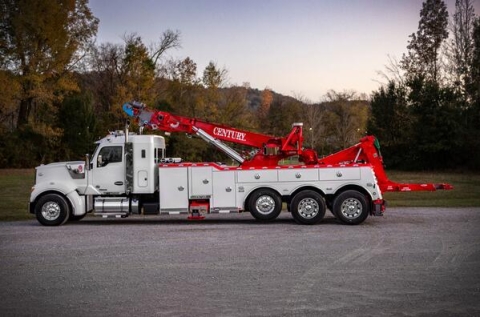 Image shows a Century®️ 1150 rotator with the recovery boom positioned over the truck chassis cab and the knee-boom underlift elevated to a maximum horizontal height.  This was done to demonstrate the incredible versatility of the knee-boom over other style underlifts.