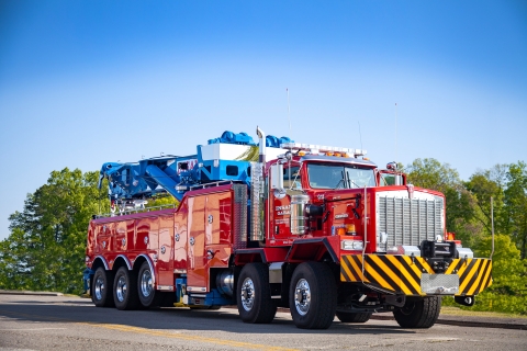 front of a red and blue century m100 on a kenworth c500 chassis