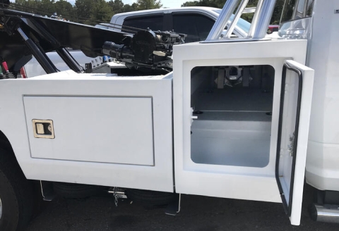 This image shows the inside of a tunnel box on a light-duty wrecker from Miller Industries.