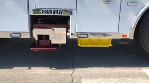 Image showing the outrigger spade option being securely stowed under the rotator toolbox using the spade holder option from Miller Industries. This provides easy access to the spade and helps keep the toolboxes clean.