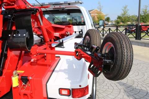 This image shows a swing-out dolly storage system option for light-duty wreckers and autoloaders and available from Miller Industries.