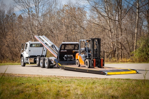 titan zla loaded with forklift with the deck on the ground