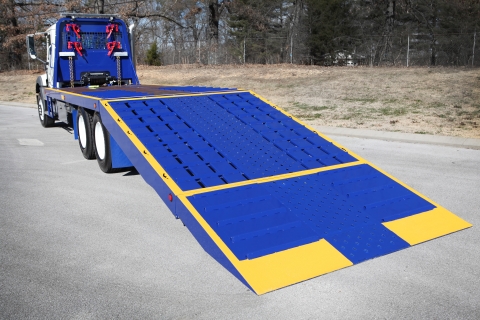 The Titan FRF is a folding ramp fladbed carrier, and is manufactured by Miller Industries.  This industrial rated carrier is specially designed for hauling heavy equipment.