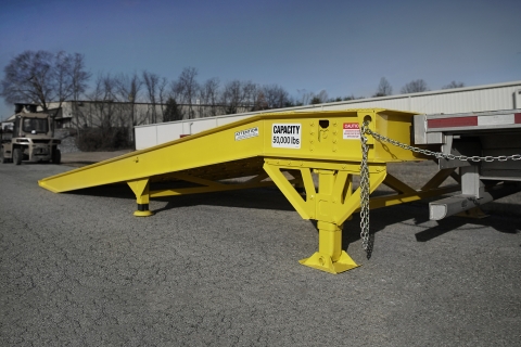 miller industries yard ramp against a step deck trailer