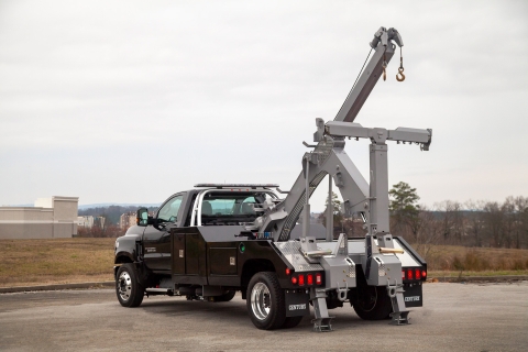 black and gray century 2465 on a chevrolet hd chassis with boom extended