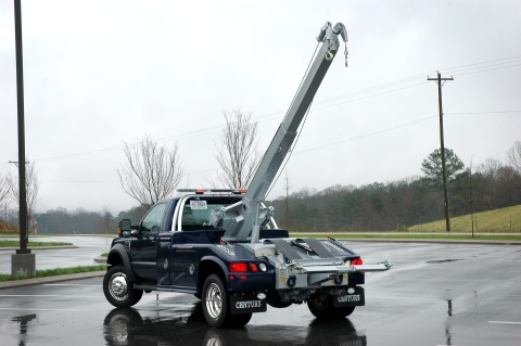 black and gray century 412 wrecker with boom extended