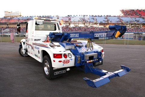 white and blue century 602 at a racetrack