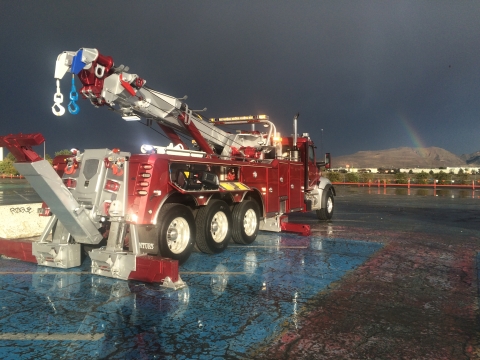 century 1140 with outriggers out and underlift tilted in a wet parking lot