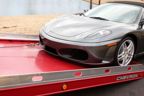 winching a gray ferrari onto a chevron 12 series lcg with loadrite option