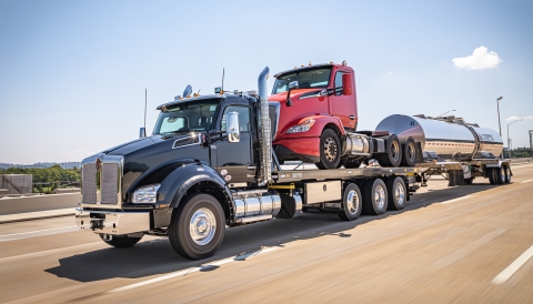 Black Century 30 Series LCG industrial carrier on a Kenworth T880 with a Kenworth tractor on the deck towing a fuel tanker