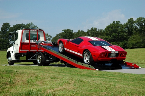 white and red century 12 series lcg with right approach option loaded with a red ford gt