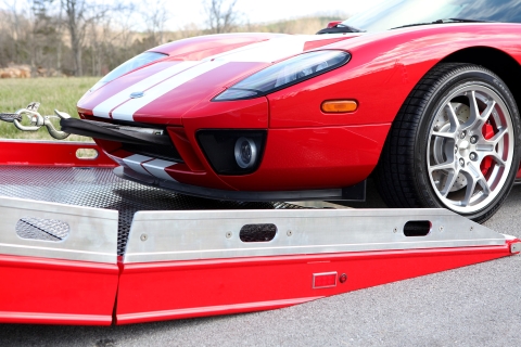 approaching a century 12 series lcg carrier with right approach in a red ford gt