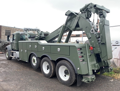 This image shows the rear of a Century 9055 heavy-duty wrecker from Miller Industries