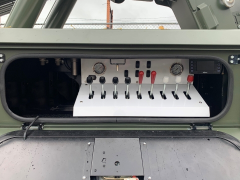 Image showing the driver's side control station on the Century 9055 heavy-duty wrecker.