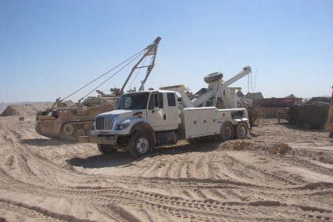 Century 5230 recovering an APC in desert war-time environment.