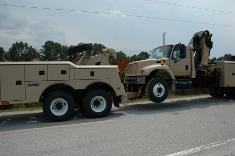 Image of a military truck being towed on the 4024 underlift.