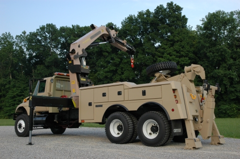 Driver's side view of the Century 4024 with recovery arm deployed toward the passenger side.