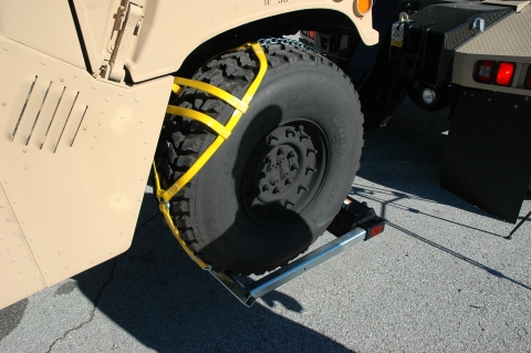 Image of the 806M Wheellift Tire Retainer on a humvee tire