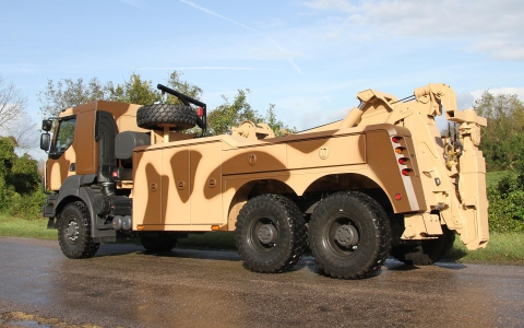 Rear view of a century 5230 in tan desert camouflage.