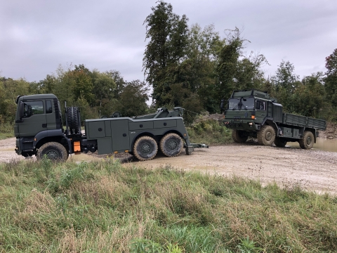 5230 recovering an armored military personnel carrier from the mud.