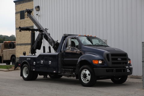Front view image of a Century 3212 G2 wrecker mounted on a Ford truck chassis.