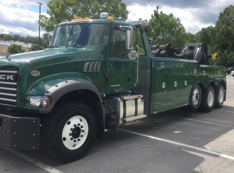 Front view of a Century 9055 heavy-duty wrecker mounted on a Mack truck chassis