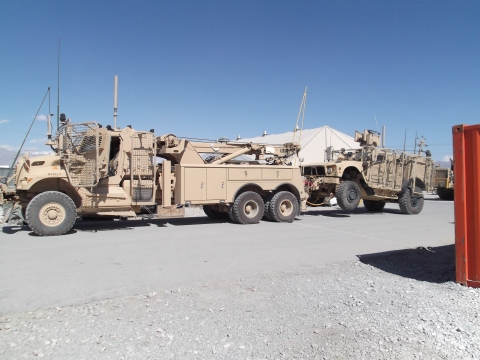 A Century 1135 towing a Military ATV in an active war zone