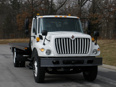 Front view of a Century heavy-duty military carrier mounted on an off-road white truck chassis