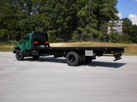 Rear view of a Century military carrier in army green