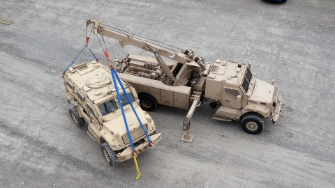 1135 rotator lifting a military APC