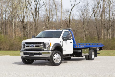 white ford f550 with chevron 10 series car carrier blue steel bed