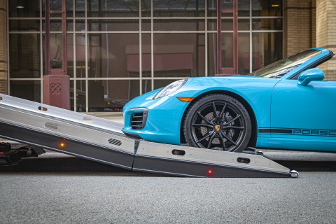 century 10 series car carrier with right approach option loading a porsche carrera